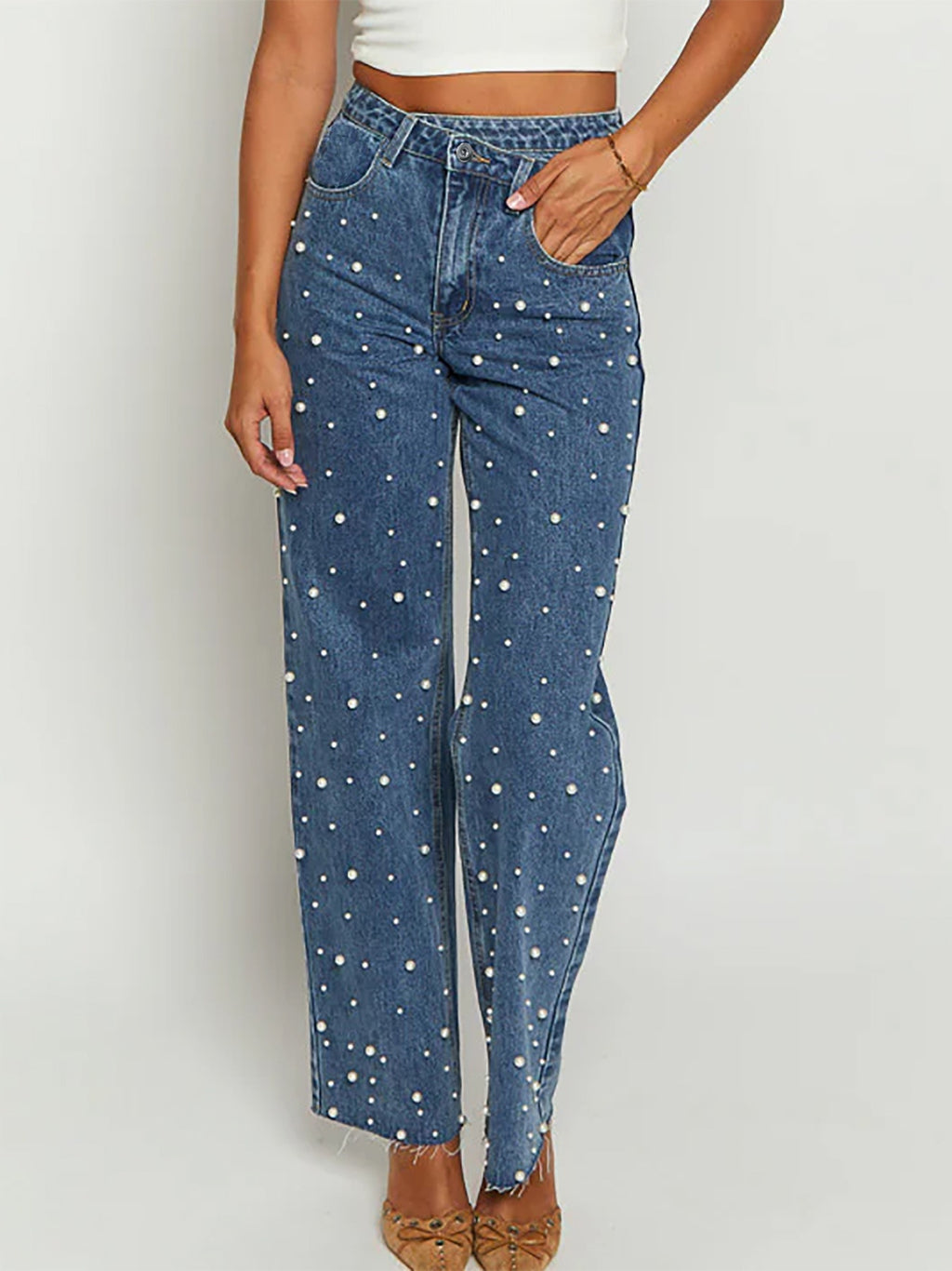 Slanted waist crossover jeans with straight leg and frayed hem
